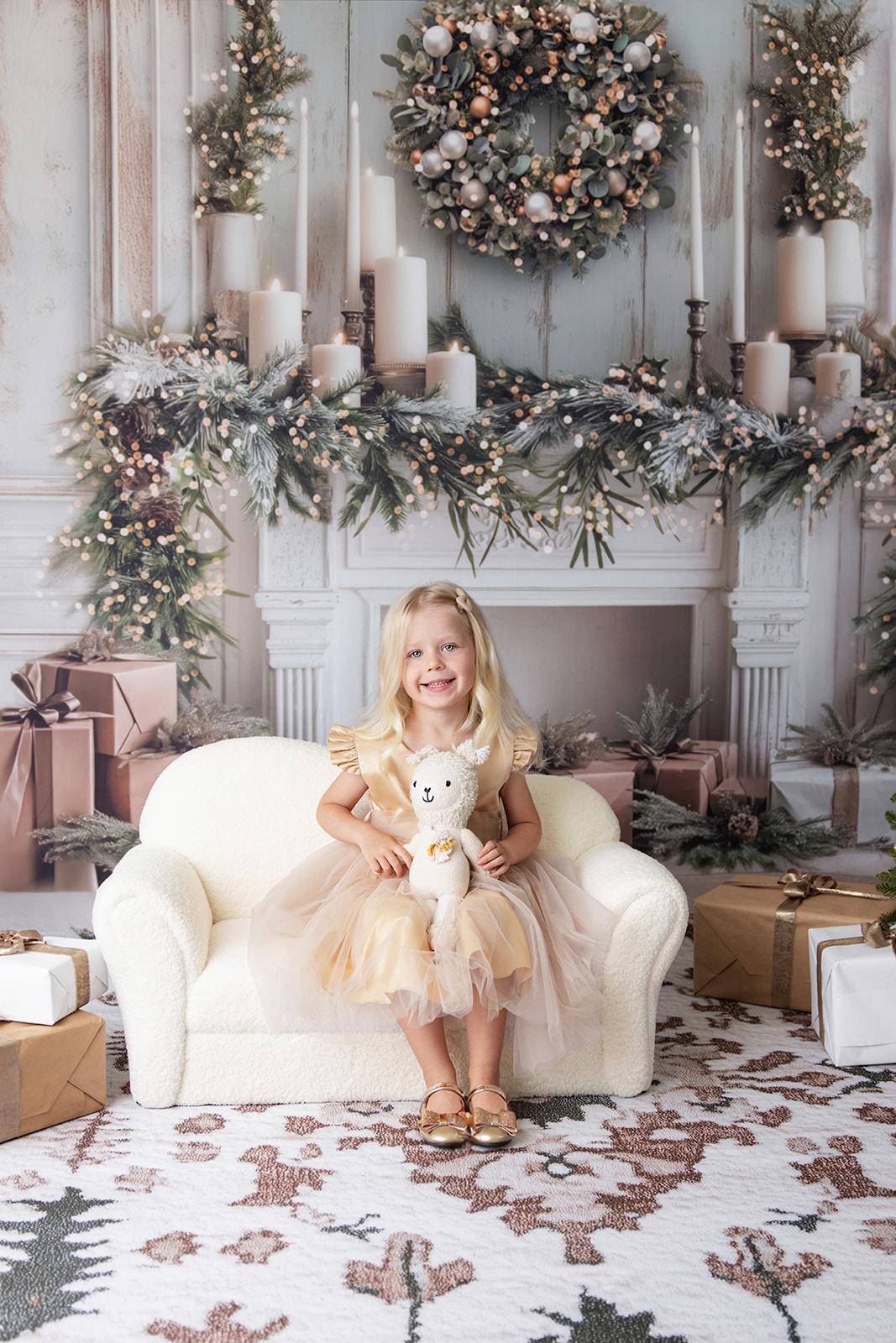 Smiling young girl sitting in front of a decorated Christmas tree during a holiday photo session by FrameIt Bay Area